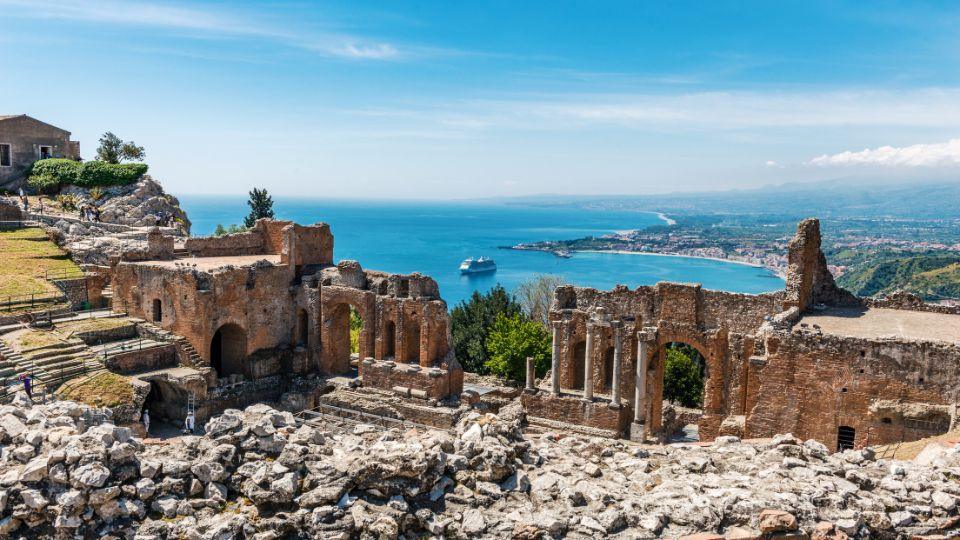 The Ancient Greek Theatre of Taormina with stunning views of the coastline and Mount Etna